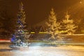 Christmas tree with lights and a garland in the village Royalty Free Stock Photo