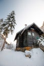 Wooden house in winter forest in austria