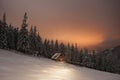 Wooden house in winter forest in Carpathian mountains Royalty Free Stock Photo