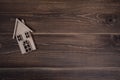 Wooden house on a wooden background. Buying a house with a young family. Affordable housing. banner. Family psychology Royalty Free Stock Photo