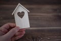 Wooden house on a wooden background. Buying a house with a young family. Affordable housing. banner. Family psychology Royalty Free Stock Photo