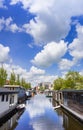 Wooden houseboats in the canal in Groningen