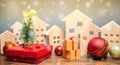 Wooden houses, Christmas tree and gifts. Christmas Sale of Real Estate. New Year discounts for buying housing. Purchase apartments Royalty Free Stock Photo