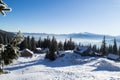 Wooden houses among the mountains and firs