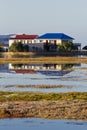 Wooden houses next to a lake or lagoon Royalty Free Stock Photo