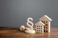 Wooden houses and paragraph figurine with judge hammer. Litigation in housing and real estate disputes. Norms and rules