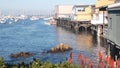 Wooden houses on piles, ocean bay harbor. Old Fisherman's Wharf. Monterey Marina