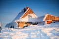 Wooden houses in snowy scenery