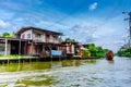 Wooden houses on stilts on the riverside of Chao Praya River, Bangkok, Thailand
