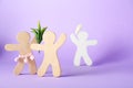 Wooden human figures fighting for attention of their beloved on lilac background, space for text. Jealousy concept