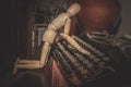 Wooden Human Manikin posing with an antique typewriter Royalty Free Stock Photo