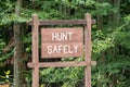 A wooden hunt safely sign on the side of the road in Tidioute, Pennsylvania, USA