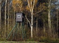 Wooden hunter box in sunny autumn forest Royalty Free Stock Photo