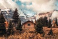 Wooden hut with Assiniboine mountain in autumn forest at provincial park Royalty Free Stock Photo