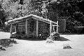 Wooden hut with wooden chairs under the straw roof in the countryside Madeira, Portugal Royalty Free Stock Photo