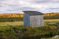 Wooden hut in the field. Holidays in the countryside. A small wooden house Royalty Free Stock Photo