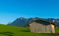 Wooden Hut in front of alpine mountain range Alps Bavaria Royalty Free Stock Photo