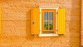 Wooden hut with orange shutters Royalty Free Stock Photo