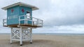 Wooden hut white blue colors on stilts of the lifeguards on sand beach of deauville in france Royalty Free Stock Photo