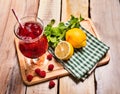 On wooden is ice cold beverage glass with berries cocktail . Royalty Free Stock Photo