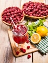 On wooden is ice cold beverage glass with berries cocktail . Royalty Free Stock Photo