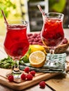 On wooden are ice cold beverage glasses with berries cocktail . Royalty Free Stock Photo