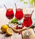 On wooden are ice cold beverage glasses with berries cocktail . Royalty Free Stock Photo