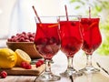 On wooden are ice cold beverage glasses with berries cocktail . Royalty Free Stock Photo