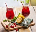 On wooden are ice cold beverage glasses with berries cocktail . Royalty Free Stock Photo