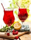 On wooden are ice cold beverage glasses with berries cocktail . Royalty Free Stock Photo