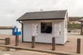Wooden ice cream vendor stall selling treats at seaside location