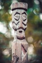 Wooden idol in the forest