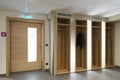 Wooden illuminated garderobe next door