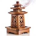 Wooden incense burner with intricate smoke-flow tower Royalty Free Stock Photo