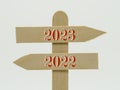 Wooden indicator sign with the year 2023 and 2022