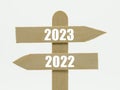 Wooden indicator sign with the year 2023 and 2022