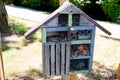 Wooden insect house decorative bug hotel ladybird bee home for house garden to butterfly hibernation and ecological gardening Royalty Free Stock Photo