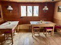 Wooden interior of charming mountain hut in Swiss Alps. Royalty Free Stock Photo