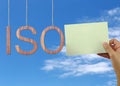 Wooden ISO text Stands for International Organization for Standardization hanging on rope. Royalty Free Stock Photo