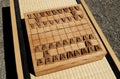 Wooden Japan Chess Outdoor on Rattan Table Royalty Free Stock Photo