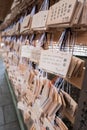 Wooden Japanese prayer tablets with wishes Royalty Free Stock Photo