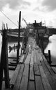 Wooden jetty in boat dock on black and white photography Royalty Free Stock Photo