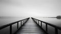 Wooden jetty on a foggy lake in black and white Royalty Free Stock Photo