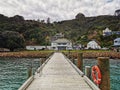 Wooden jetty and harbour buildings at Whangaroa harbour on the North Island of New Zealand