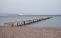 Wooden jetty at Ipsos beach Royalty Free Stock Photo