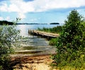 Wooden jetty in the lake of Malaren on a beautiful summer day