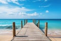 Wooden jetty over the clean blue sea or ocean on tropical beach on sunny summer day