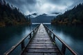 Wooden jetty over the mountain lake with forest on rainy cloudy gloomy day Royalty Free Stock Photo