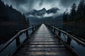 Wooden jetty over the mountain lake with forest on rainy cloudy gloomy day Royalty Free Stock Photo