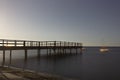 Wooden jetty over the sea with silk effect on a starry summer night, Spain